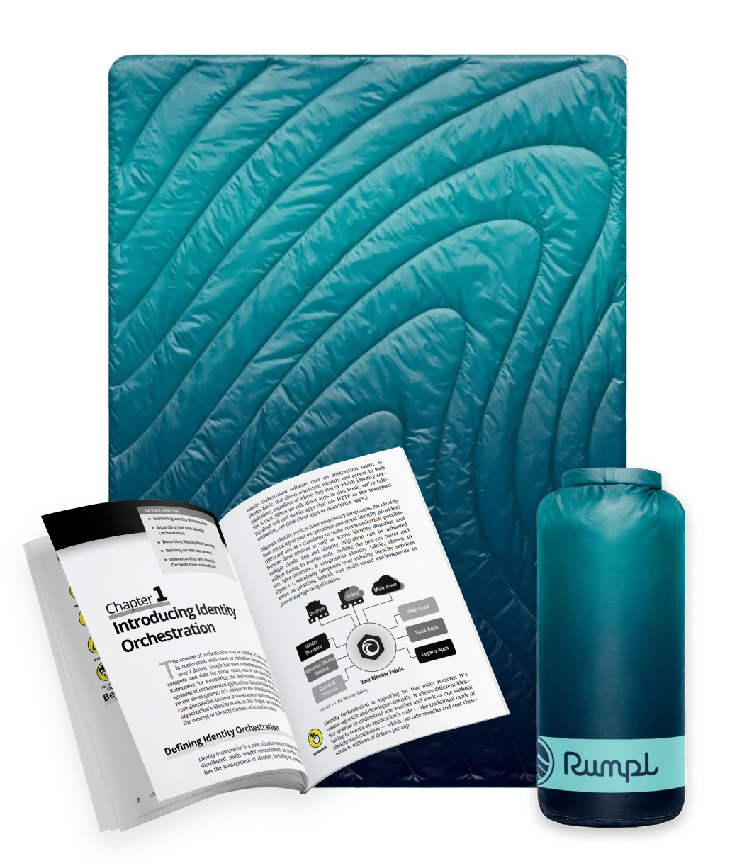 A rolled-up teal Rumpl blanket sits next to an unfolded matching blanket. Nearby, there's a book titled "Identity Orchestration for Dummies" with a purple and yellow cover, providing insights inspired by Forrester TEI on Maverics Identity Orchestration.