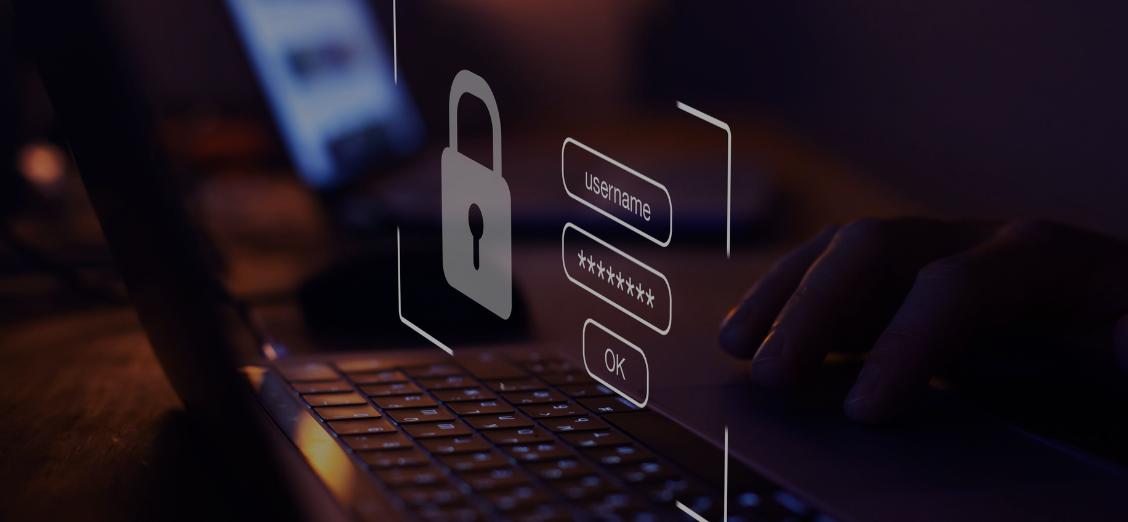 Hands typing on a laptop keyboard with a digital overlay featuring a padlock, username, password field, and an "OK" button evoke a login interface with strong identity security measures.